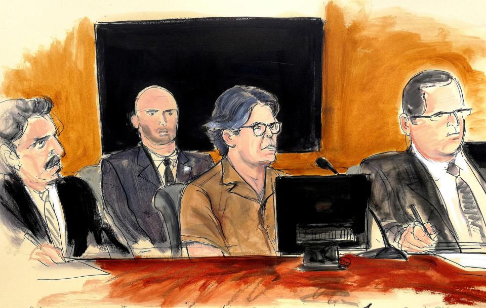 In this courtroom sketch Keith Raniere, second from right, leader of the secretive group NXIVM, attends a court hearing Friday, April 13, 2018.