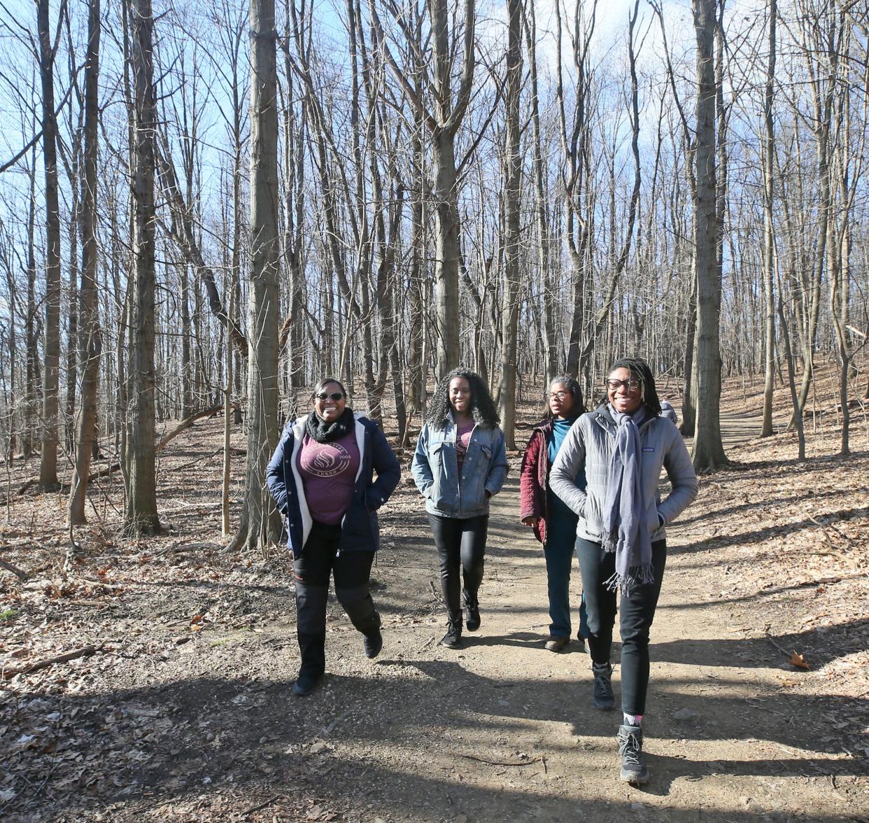 Members of Black Women Explore, from left Rachelle Yarbrough, Vinga Hart, Traci Lewis and Bronlynn Thurman take a short walk at Goodyear Heights Metro Park in Akron.