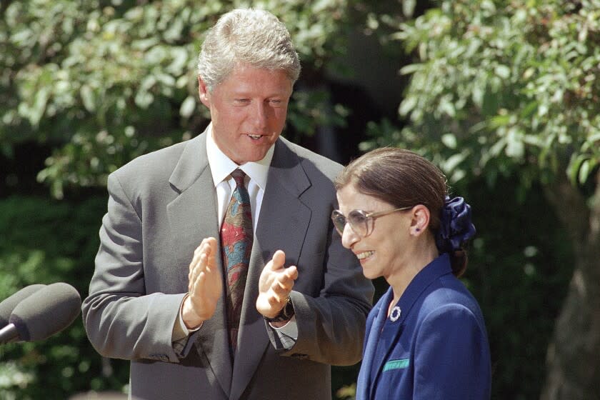 FILE - In this June 15, 1993, file photo, President Bill Clinton applauds as Judge Ruth Bader Ginsburg prepares to speak in the Rose Garden of the White House,after the president announced he would nominate Ginsburg to the Supreme Court. Ginsburg, 60, a federal appeals judge, will fill the vacancy left by the retirement of Justice Byron White. Ginsburg, a diminutive yet towering women's rights champion who became the court's second female justice, has died at her home in Washington. (AP Photo/Doug Mills, File)