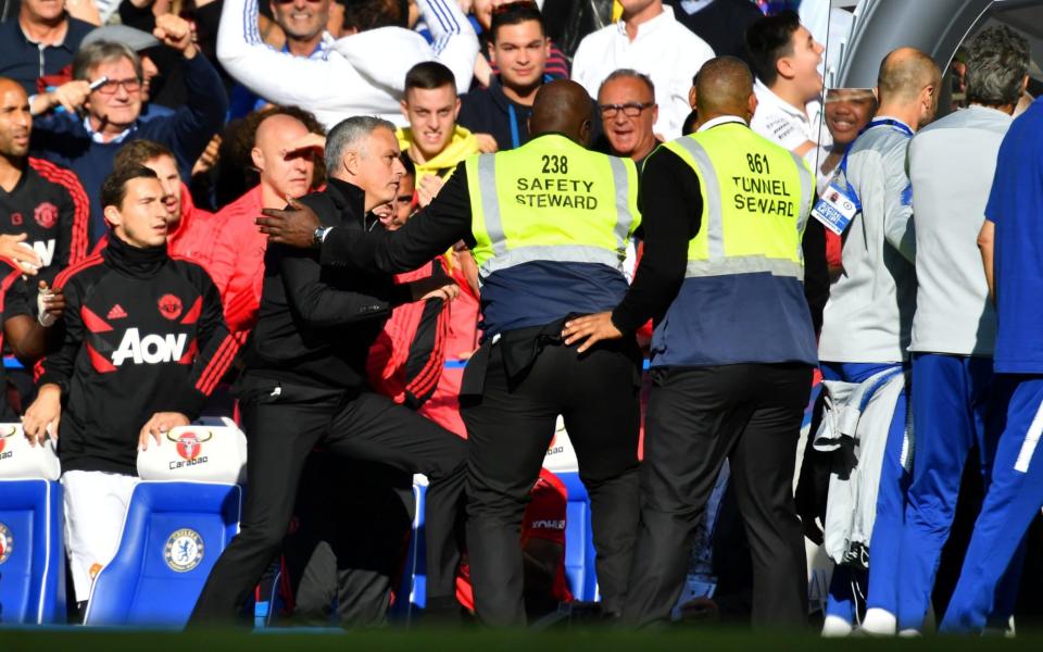 Jose Mourinho was stopped in his tracks by two stewards - REUTERS