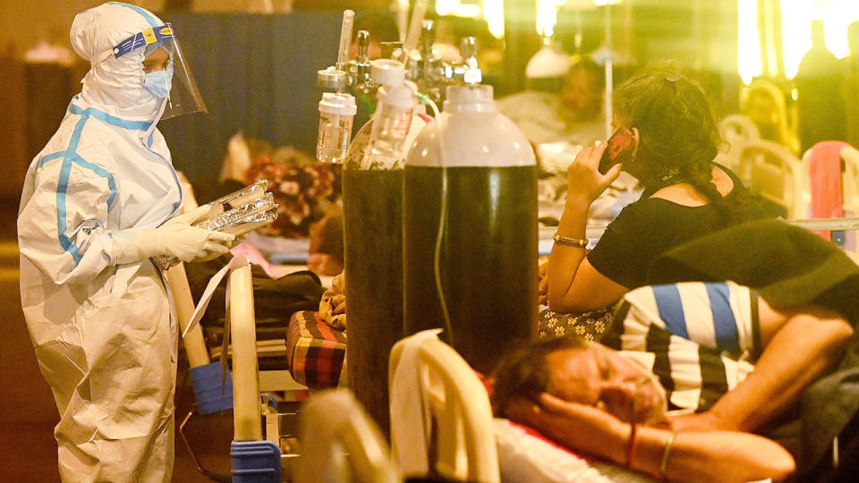 Seen here, coronavirus patients are attended to in a Delhi hospital.