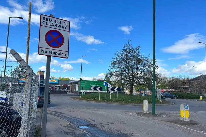 Roundabout on Daleside Road/Daleside Road East, near Eastpoint Retail Park, with Red Route Clearway, No Stopping sign in foreground, where car meets have been taking place