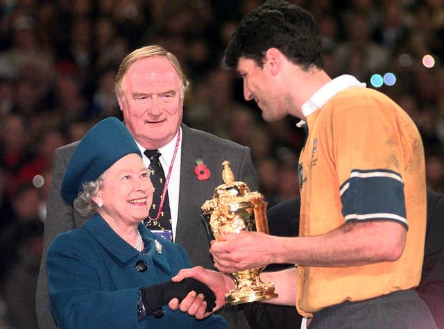 John Eales, captain of Australia received the 199 Rugby World Cup trophy from the Queen