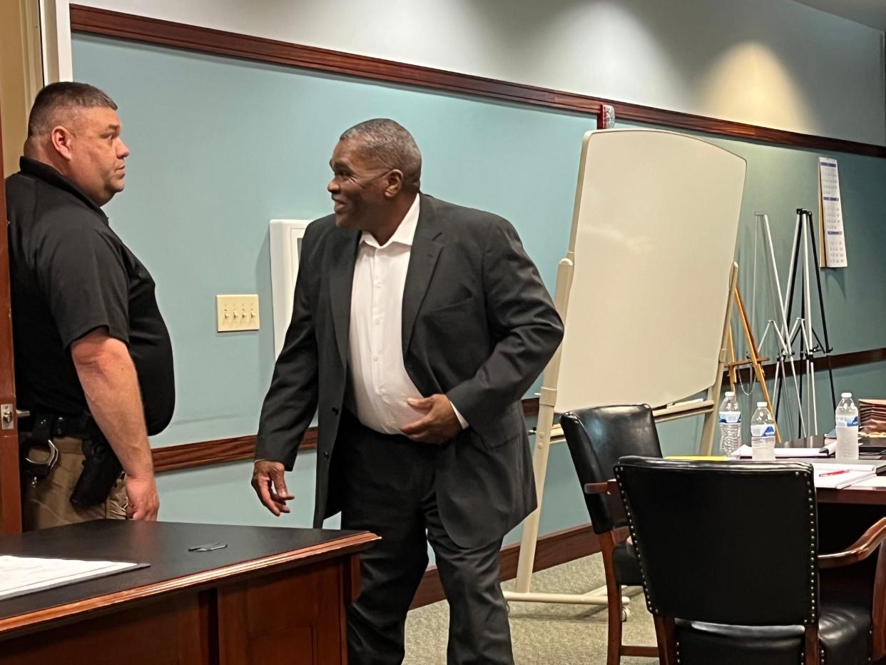 Ronald Simpson, 57, speaks with a Kenton County Sheriff’s Deputy during the first day of his murder trial on May 30, 2023.