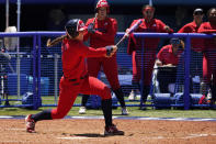 United States' Amanda Chidester watches her game winning hit in the eight inning of a softball game against Australia at the 2020 Summer Olympics, Sunday, July 25, 2021, in Yokohama, Japan. (AP Photo/Sue Ogrocki)