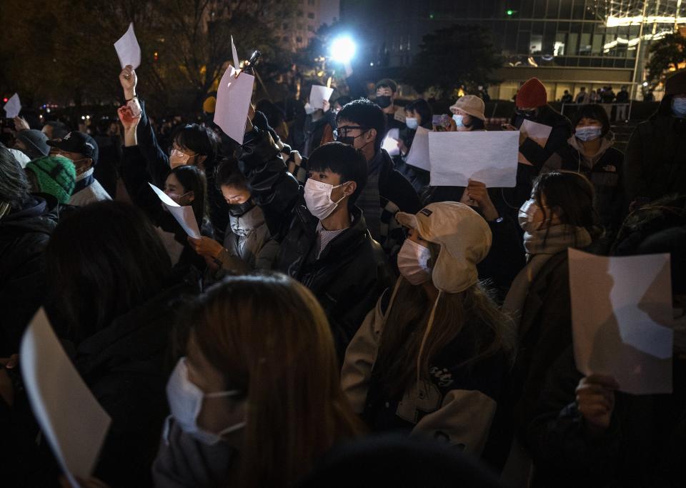 Protesters hold up a white piece of paper against censorship during a protest against China’s strict COVID measures on Nov. 27, 2022, in Beijing.