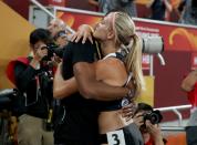 <p>Brianne Theisen Eaton of Canada embraces Ashton Eaton of the United States after crossing the finish line in the Women’s Heptathlon 800 metres during day two of the 15th IAAF World Athletics Championships Beijing 2015 at Beijing National Stadium on August 23, 2015 in Beijing, China. (Photo by Patrick Smith/Getty Images) </p>