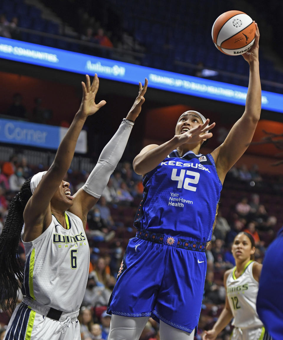 Connecticut Sun center Brionna Jones (42) shoots over Dallas Wings forward Kayla Thornton (6) during a WNBA basketball game Tuesday, May 24, 2022, in Uncasville, Conn. (Sean D. Elliot/The Day via AP)