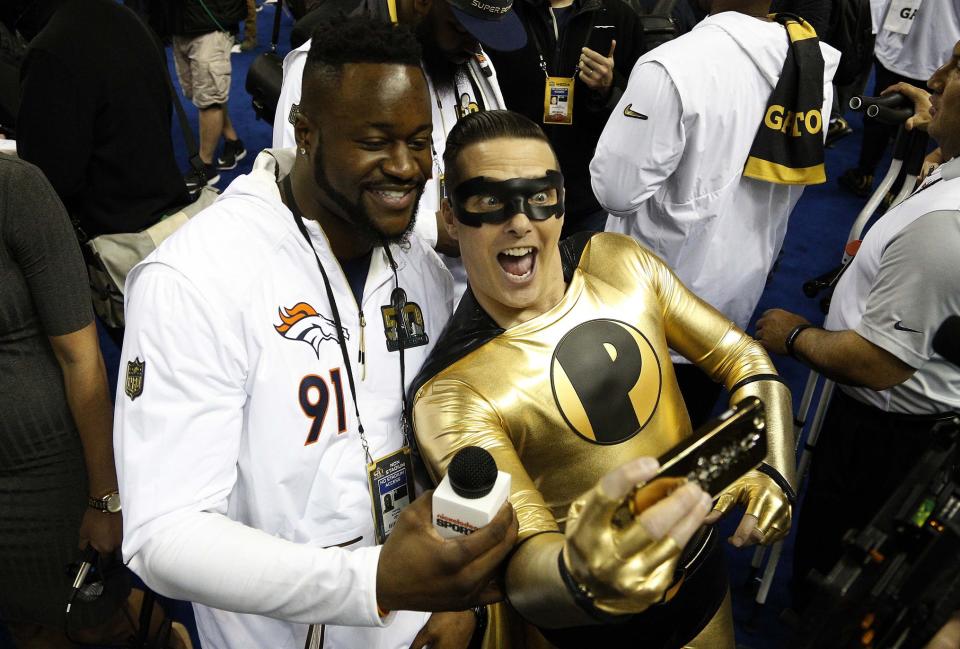 Super Bowl Media Day is known for its occasional hijinks, such as the appearance of Nickelodeon personality Pick Boy, seen here with Denver Broncos defensive end Kenny Anunike before Super Bowl 50.