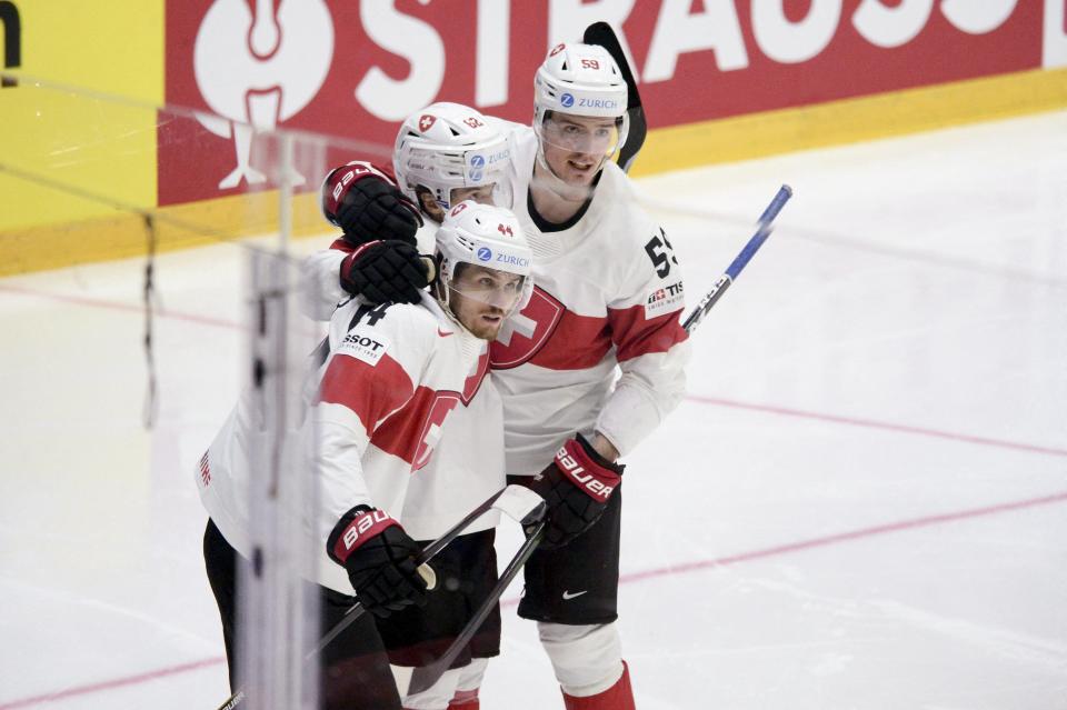 Switzerland's forward Pius Suter celebrates scoring with his teammates during the 2022 IIHF Ice Hockey World Championships preliminary round group A match between Canada and Switzerland in Helsinki, Finland, on May 21, 2022.