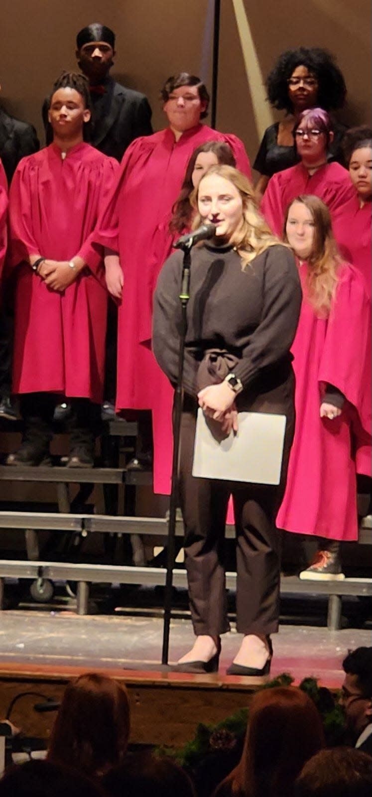 New Monroe High School choir director Carli Tower is shown at Thursday's choir concert.