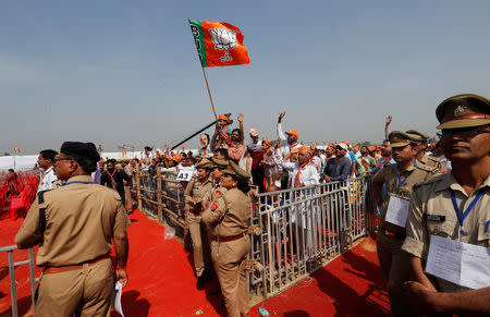 Supporters of India's ruling Bharatiya Janata Party (BJP) waves towards Prime Minister Narendra Modi during an election campaign rally in Meerut in the northern Indian state of Uttar Pradesh, India, March 28, 2019. REUTERS/Adnan Abidi