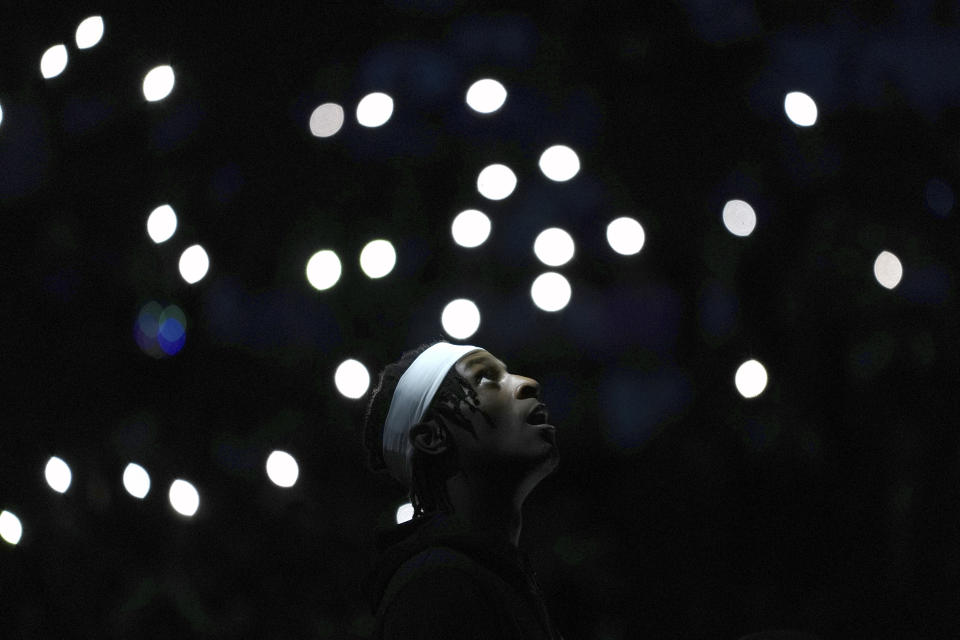 Minnesota Timberwolves forward Leonard Miller stands on the court as players are introduced before an NBA basketball game against the Detroit Pistons, Wednesday, March 27, 2024, in Minneapolis. (AP Photo/Abbie Parr)