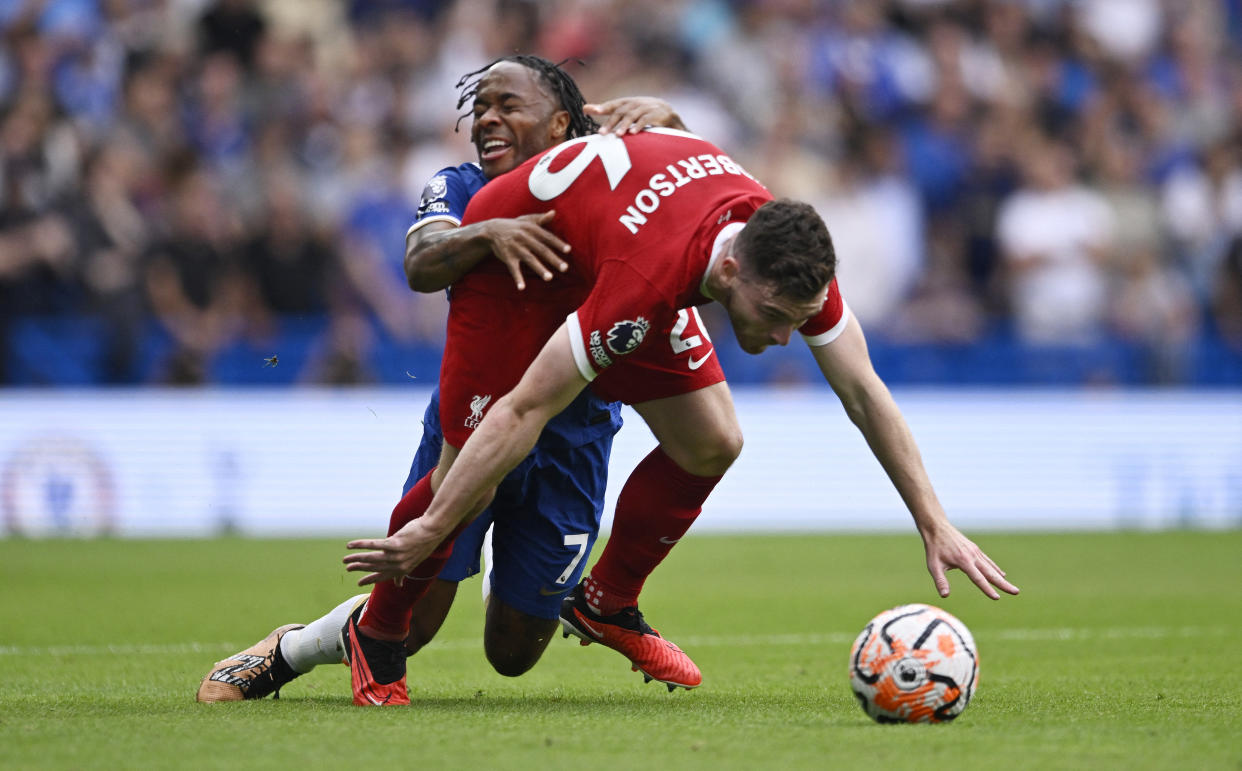 Liverpool's Andrew Robertson (front) tussles with Chelsea's Raheem Sterling for the ball during their English Premier League clash.