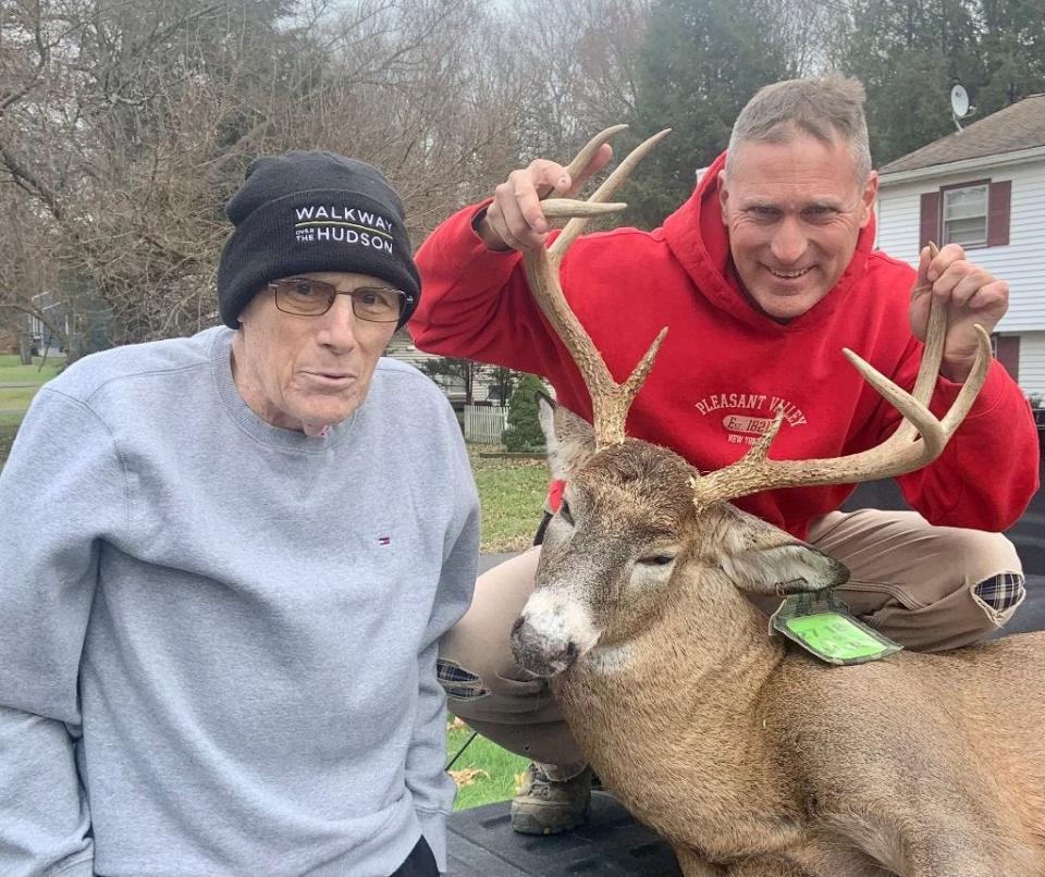 John Haight, left, poses with his son, Kevin, of LaGrange, after harvesting an eight-point buck.