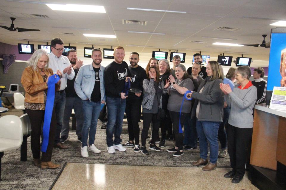 Attendees celebrate after the ribbon was cut on Friday, March 3 during a grand reopening celebration at the Adel Family Fun Center.