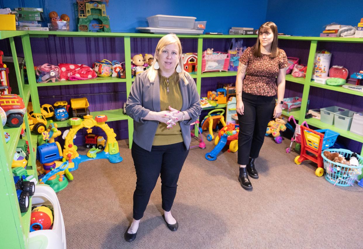 Kristina Drummer, executive director of Alliance Area Domestic Violence Shelter, left, and Hannah Schmid, community engagement specialist at the shelter, stand Thursday, April 18, 2024, in the facility's play room.