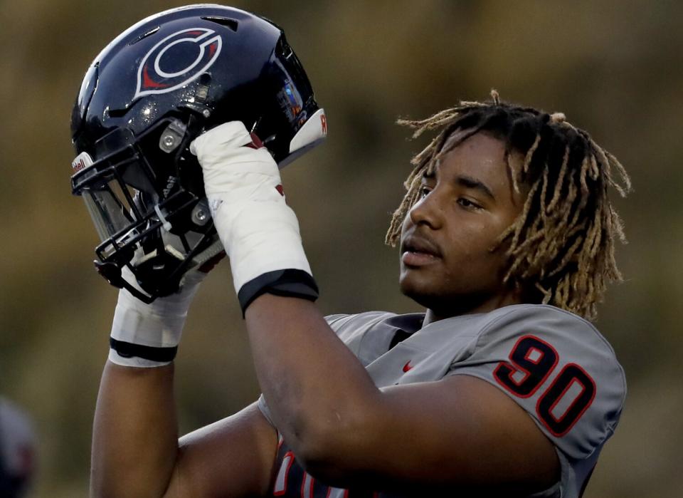 Corona Centennial defensive end Korey Foreman warms up before a game against Mater Dei in 2019.