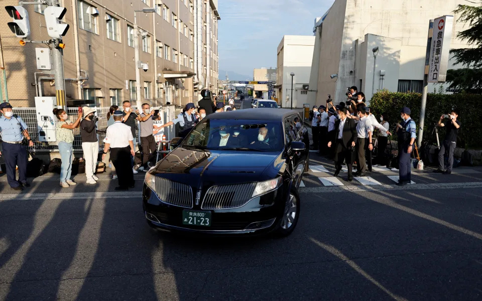 A motorcade believed to be transporting the body of late former Japanese Prime Minister Shinzo Abe who was shot while campaigning for a parliamentary election, leaves at Nara Medical University Hospital, in Kashihara, Nara prefecture, Japan July 9, 2022. REUTERS/Issei Kato