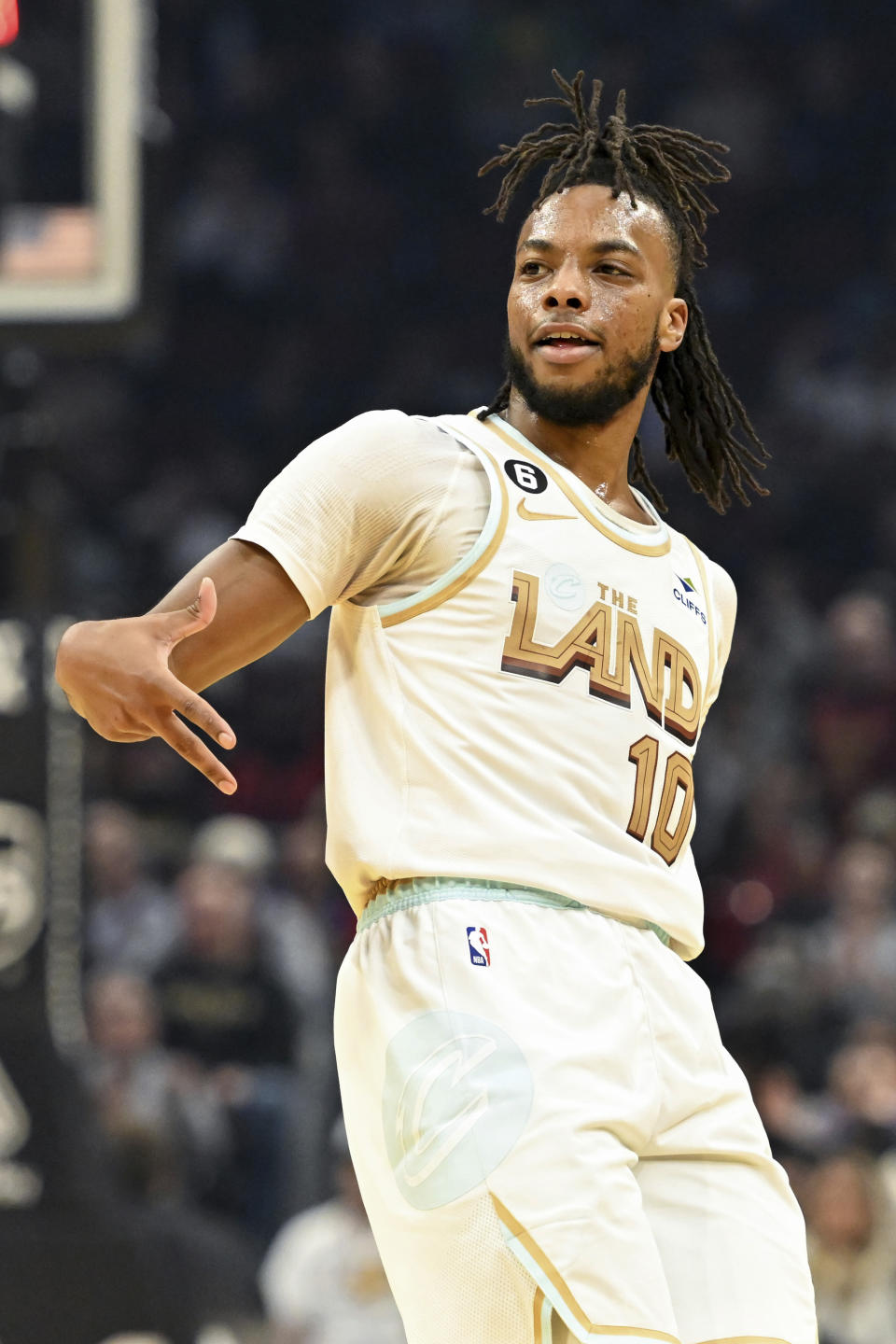 Cleveland Cavaliers guard Darius Garland celebrates making a three-point basket during the first half of an NBA basketball game against the Philadelphia 76ers, Wednesday, Nov. 30, 2022, in Cleveland. (AP Photo/Nick Cammett)