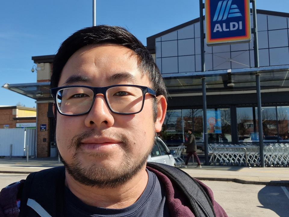 Selfie of the writer in front of Aldi