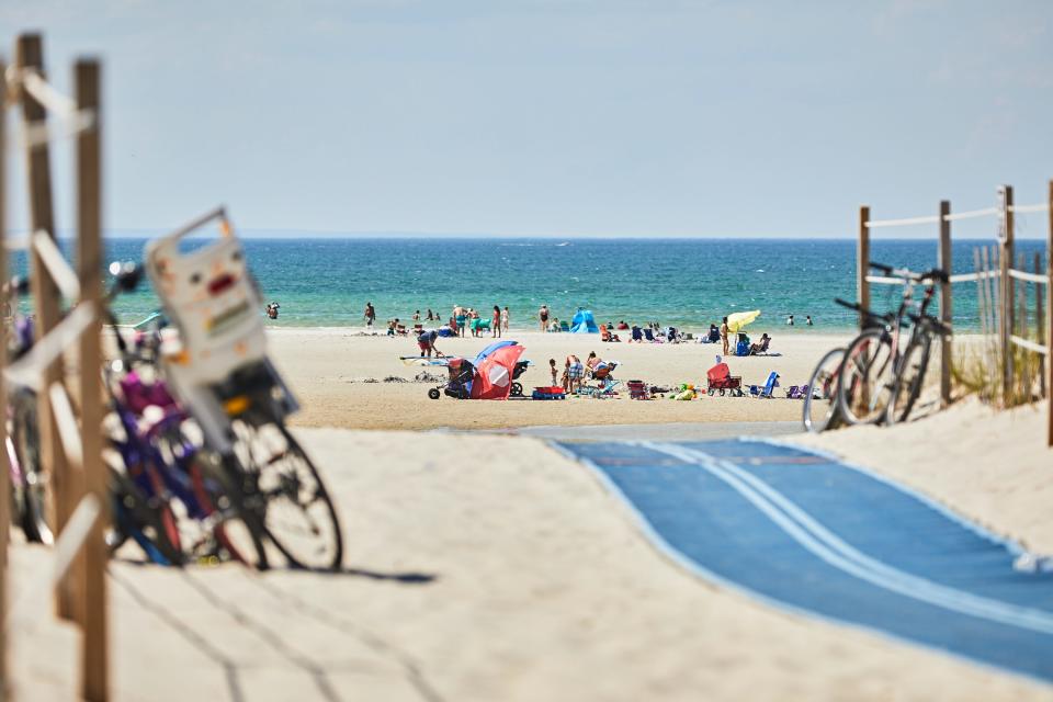 People enjoy a peaceful day at Mayflower Beach in this 2020 file photograph, unlike July Fourth weekend this year when police, and even mutual aid from other towns, were called to control oversized crowds.