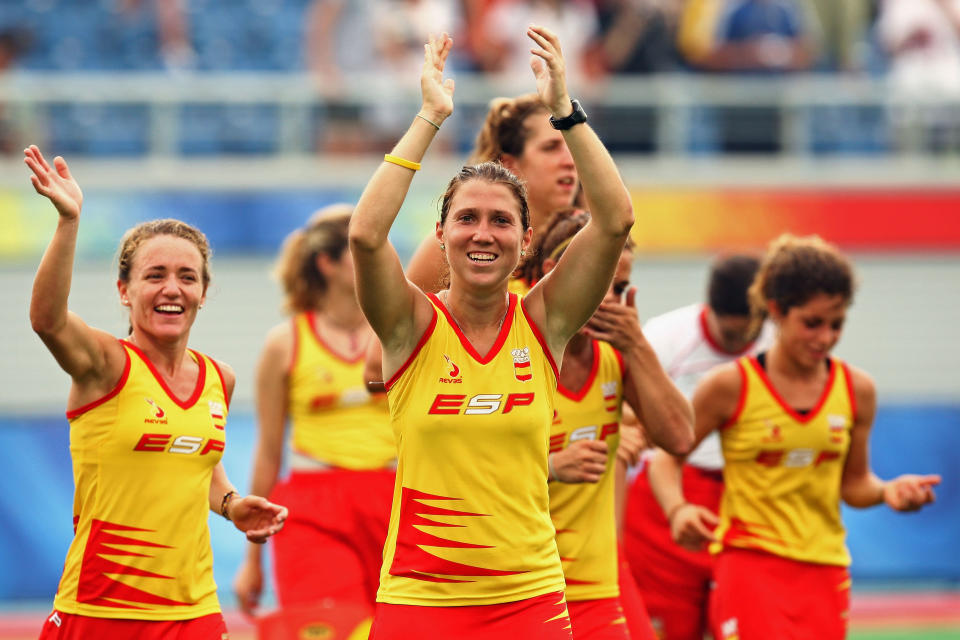 BEIJING - AUGUST 20: Julia Menendez (C) of Spain waves to the crowd after winning the Women's Classification 7-8 Match W32 between Spain and the United States at the Olympic Green Hockey Field during Day 12 of the Beijing 2008 Olympic Games on August 20, 2008 in Beijing, China.  (Photo by Quinn Rooney/Getty Images)