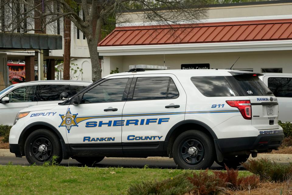 A Rankin County Sheriff's Deputy SUV drives through downtown Brandon, Miss., Friday, March 3, 2023.