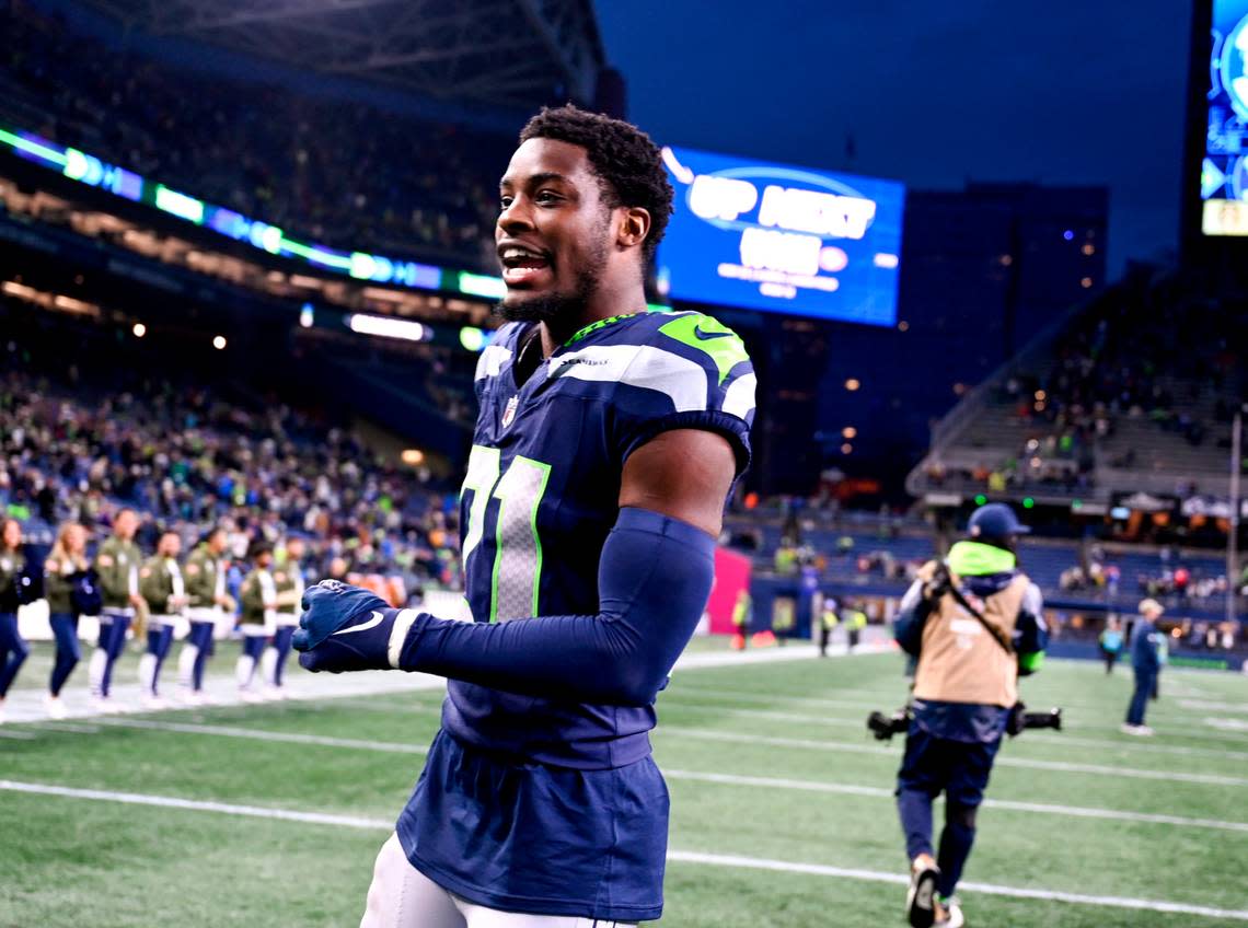 Seattle Seahawks cornerback Devon Witherspoon (21)walks over the field after the Seahawks 29-26 victory against the Washington Commanders at Lumen Field, on Sunday, Nov. 12, 2023, in Seattle, Wash.
