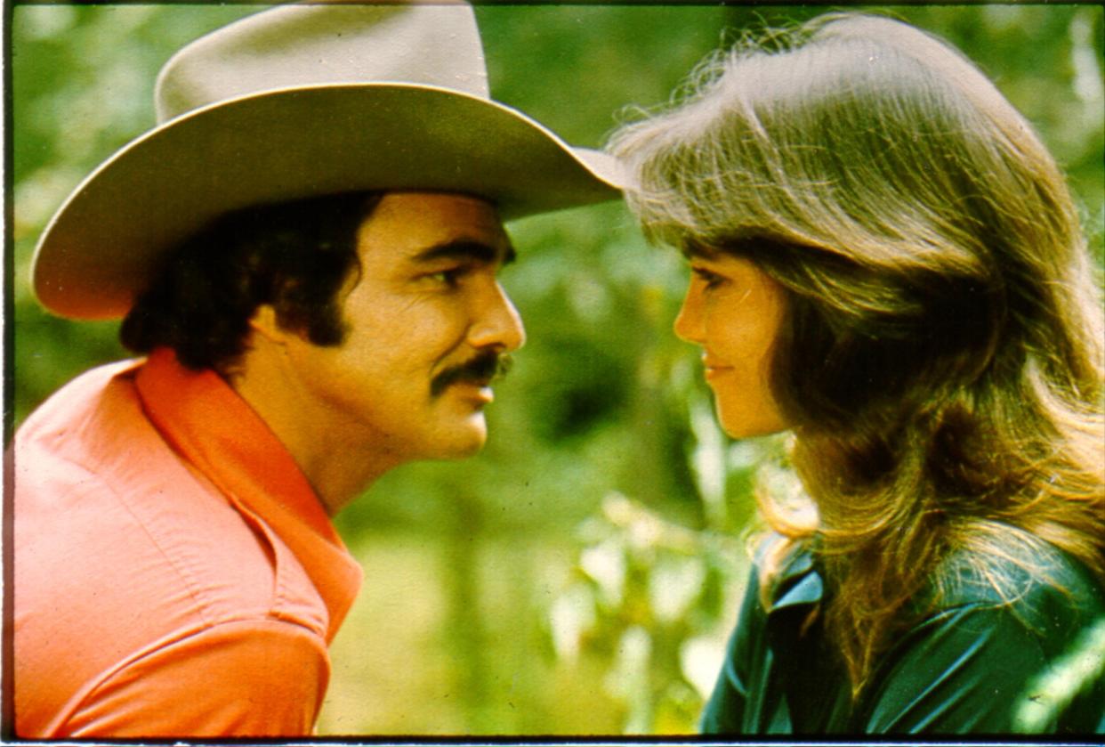 1977:  Actors Burt Reynolds and Sally Field in the film 'Smokey and the Bandit'. (Photo by Michael Ochs Archives/Getty Images)