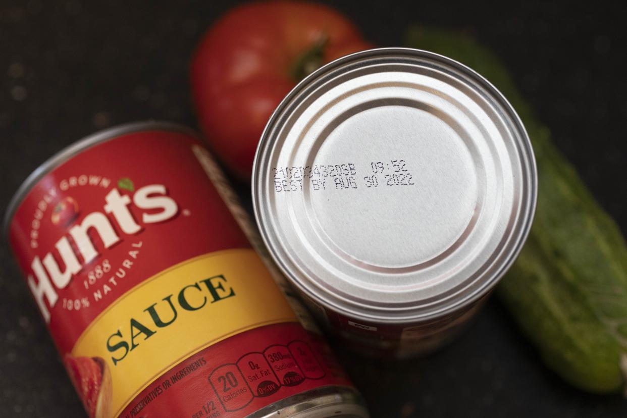 A "best by" date is seen on the top of a tomato sauce can, Saturday, Aug. 20, 2022, in Boston. As awareness grows around the world about the problem of food waste, one culprit in particular is drawing scrutiny: “best before” labels. Manufacturers have used the labels for decades to estimate peak freshness. Unlike “use by” labels, which are found on perishable foods like meat and dairy, “best before” labels have nothing to do with safety and may encourage consumers to throw away food that’s perfectly fine to eat. (AP Photo/Michael Dwyer)