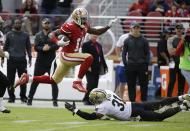 <p>San Francisco 49ers wide receiver Quinton Patton runs with the ball over New Orleans Saints free safety Jairus Byrd during the first half of an NFL football game, Sunday, Nov. 6, 2016, in Santa Clara, Calif. (AP Photo/Tony Avelar) </p>