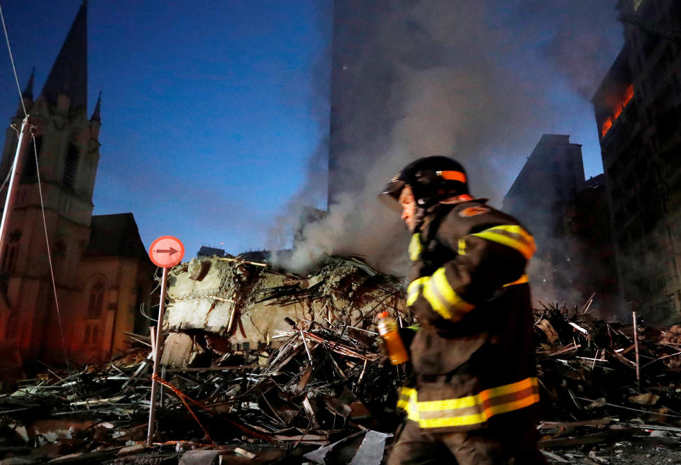 <p>A firefighter walks past the site of a building that collapsed in downtown Sao Paulo, Brazil May 1, 2018. (Photo: Leonardo Benassatto/Reuters) </p>