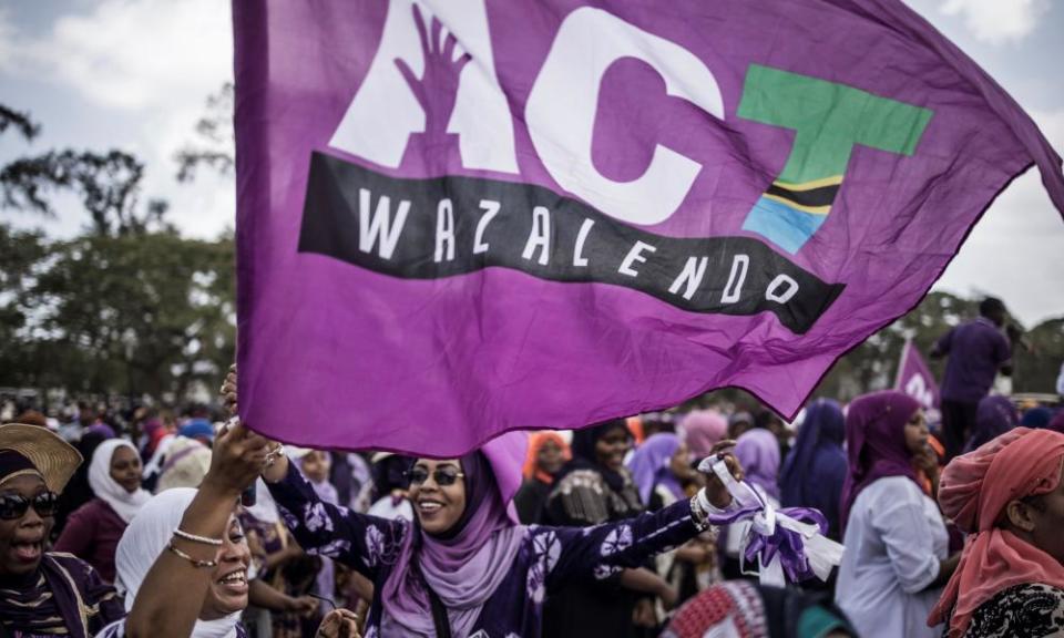 Opposition supporters wave a party flag