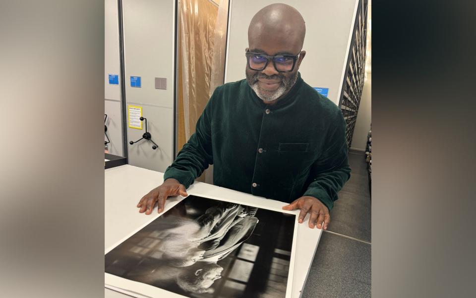 Photographer Misan Harriman with his image of the Duke and Duchess of Sussex