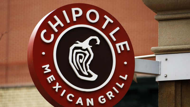 This 2017 photo displays a Chipotle restaurant sign hanging in Pittsburgh, Pa.