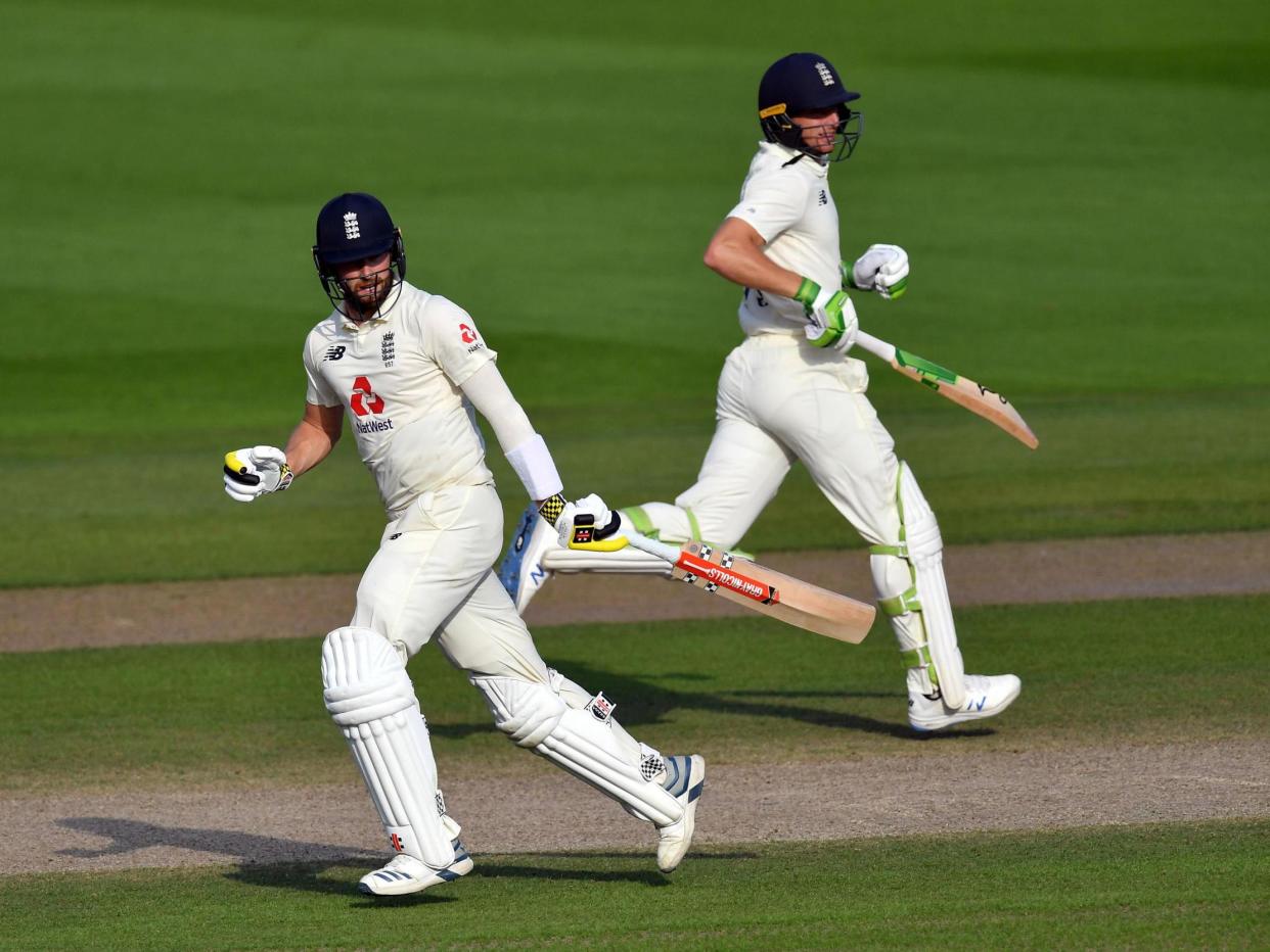 England's Chris Woakes and Jos Buttler: PA