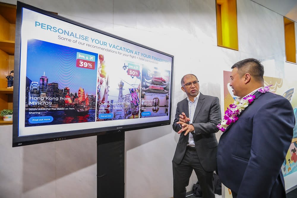 Deputy Tourism, Arts and Culture Minister Muhammad Bakhtiar Wan Chik with Malaysia Airlines Chief operating officer Ahmad Luqman Mohd Azmi at the launch of MHHolidays in Kuala Lumpur July 24, 2019. — Picture by Firdaus Latif