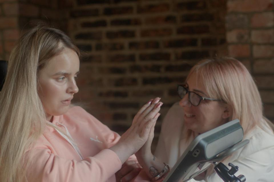 Angel high-fiving her mother Nikki at home in Leicester (PA)