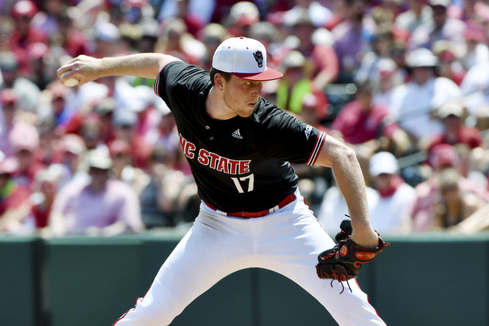 North Carolina State pitcher Sam Highfill (17) throws against Arkansas in the third inning of an NCAA college baseball super regional game Saturday, June 12, 2021, in Fayetteville, Ark. (AP Photo/Michael Woods)