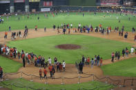 Houston Astros fans gather on the field during the baseball team's FanFest at Minute Maid Park on Saturday, Jan. 18, 2020, in Houston. (Steve Gonzales/Houston Chronicle via AP)