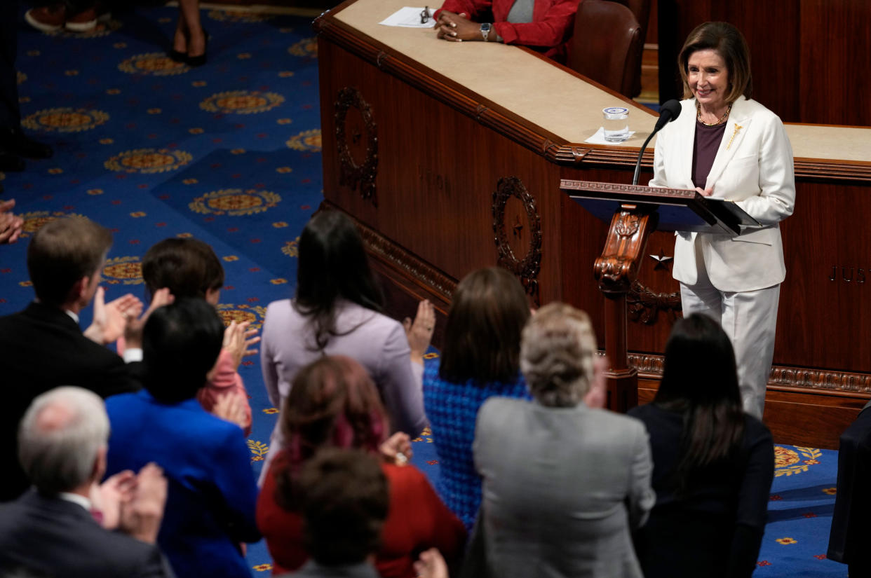 House Speaker Nancy Pelosi of Calif., pauses as lawmakers stand and applaud as she speaks on the House floor at the Capitol in Washington, on Nov. 17, 2022.