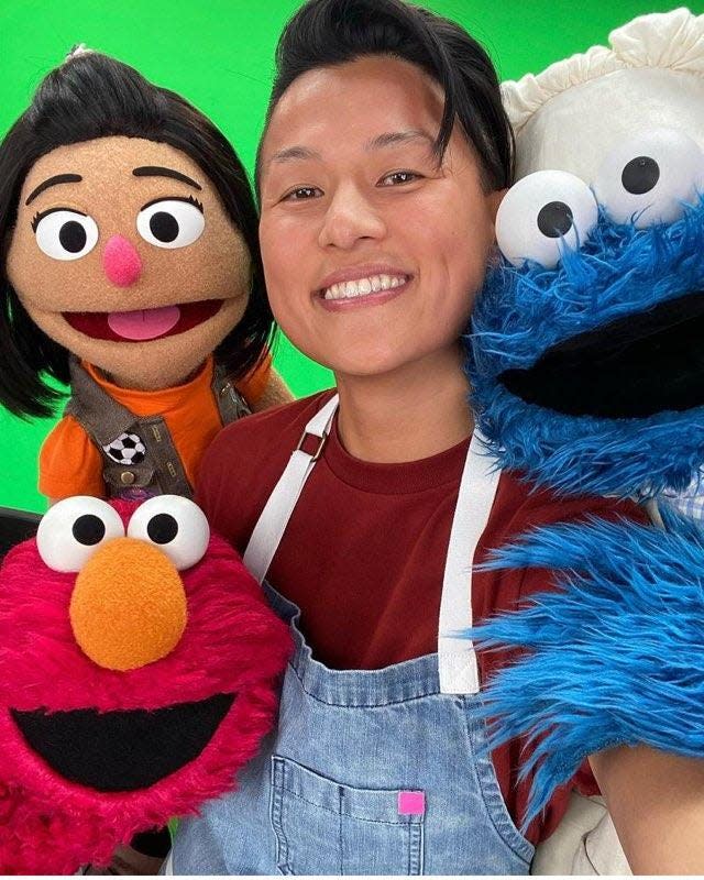 Melissa King, an all-stars winner of "Top Chef" and now one of its judges, here with Cookie Monster, Elmo and the first Asian American Muppet on "Sesame Street," Ji-Young.