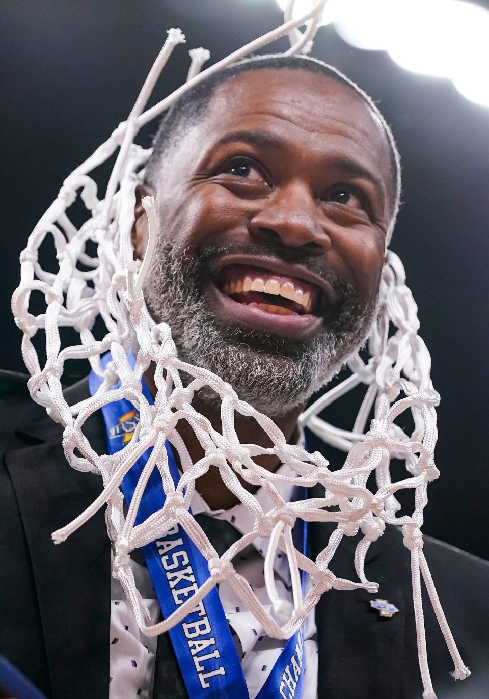 Ben Davis Giants head coach Don Carlisle wears the net on his neck on Saturday, March 25, 2023 at Gainbridge Fieldhouse in Indianapolis. The Ben Davis Giants defeated the Kokomo Wildkats, 53-41, for the IHSAA Class 4A state finals championship. 