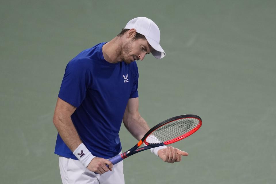 Andy Murray of Great Britain reacts after losing a ball to Denis Shapovalov of Canada during a match of the Dubai Duty Free Tennis Championships in Dubai, United Arab Emirates, Monday, Feb. 26, 2024. (AP Photo/Kamran Jebreili)