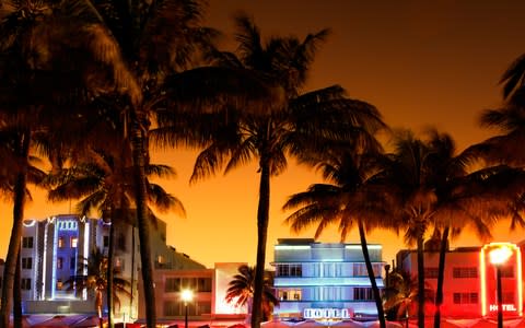 Art Deco hotels and palm trees in Miami - Credit: iStock