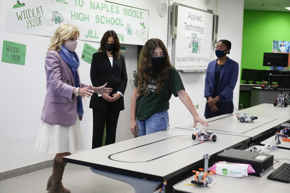 U.S. first lady Jill Biden, left, listens to an explanation in the Robotics class during a visit to Naples Middle High School, a Department of Defense Education Activity (DoDEA) school, after attending events on the sidelines of the G20 summit in Rome, Monday, Nov. 1, 2021. (AP Photo/Alessandra Tarantino)