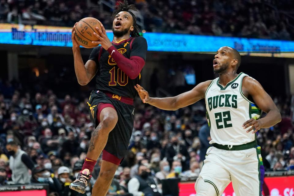 Cavaliers guard Darius Garland (10) drives to the basket past Milwaukee Bucks' Khris Middleton (22) in the second half of the Cavs' 115-99 win Wednesday night. [Tony Dejak/Associated Press]