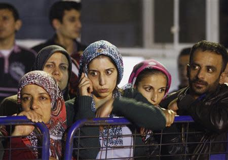 Relatives of miners who are trapped in a coal mine wait in front of a hospital in Soma, a district in Turkey's western province of Manisa May 14, 2014. REUTERS/Osman Orsal