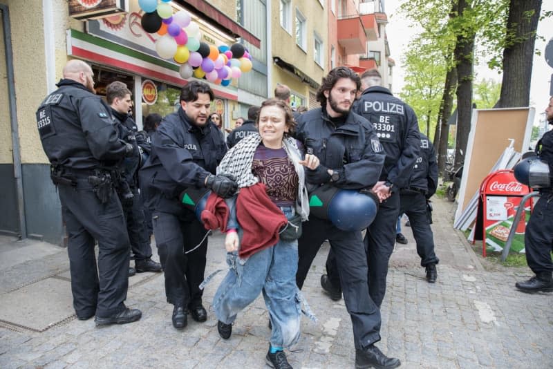 Police officers interrupt the Palestine Congress 2024 in Berlin. German police on Friday broke up a pro-Palestinian conference in the capital Berlin and asked some 250 participants to leave the venue just two hours into the three-day event. Officers had already intervened in the event during a speech via video by an activist who is banned from political activity in Germany. Michael Kuenne/PRESSCOV via ZUMA Press Wire/dpa